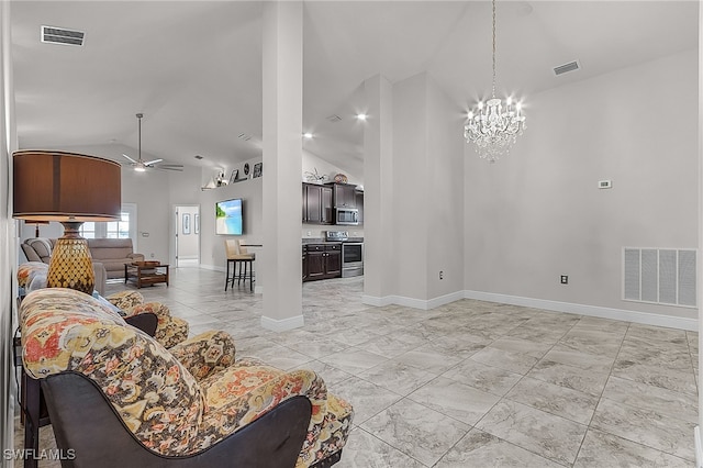 living room featuring ceiling fan with notable chandelier and lofted ceiling