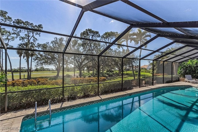 view of pool featuring a lanai and a patio