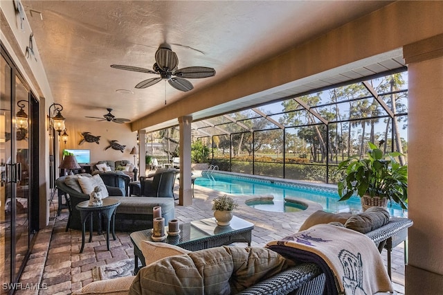 view of patio / terrace with outdoor lounge area, a swimming pool with hot tub, glass enclosure, and ceiling fan