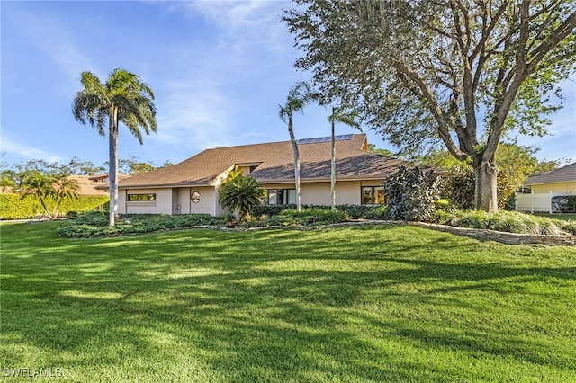 single story home featuring a front yard