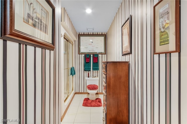 corridor featuring light tile patterned floors