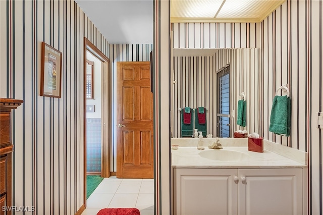 bathroom featuring tile patterned flooring and vanity