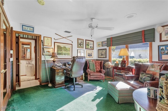 carpeted home office with ceiling fan