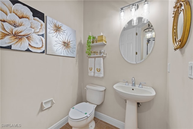 bathroom featuring tile patterned floors, sink, and toilet