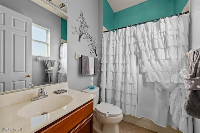 full bathroom with tile patterned floors, shower / tub combo with curtain, vanity, and toilet