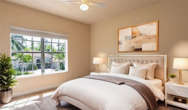 bedroom featuring ceiling fan and light carpet