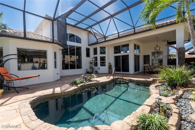 exterior space with glass enclosure and a patio area