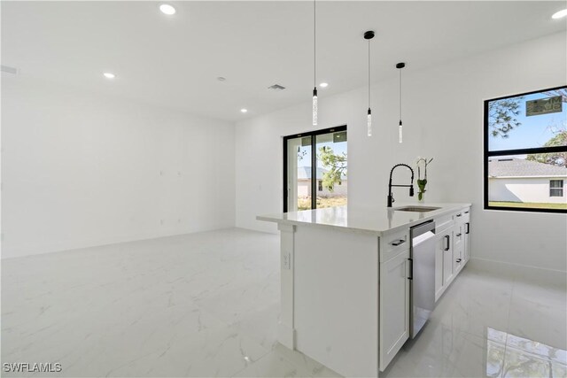 kitchen with white cabinetry, sink, dishwasher, an island with sink, and decorative light fixtures