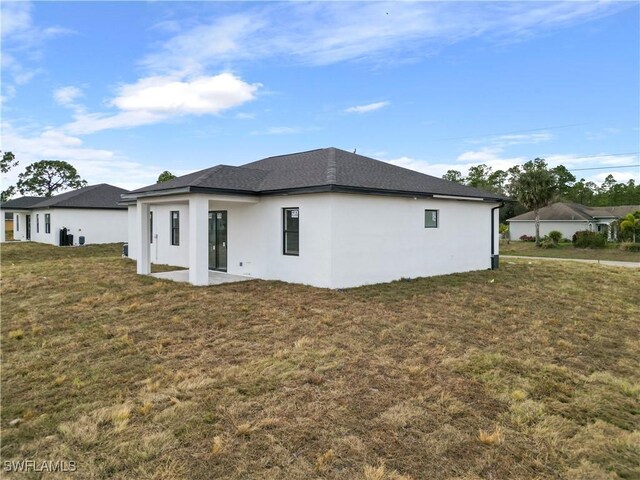 view of home's exterior featuring a yard