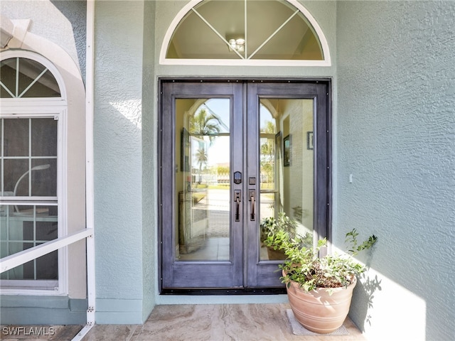 property entrance featuring french doors