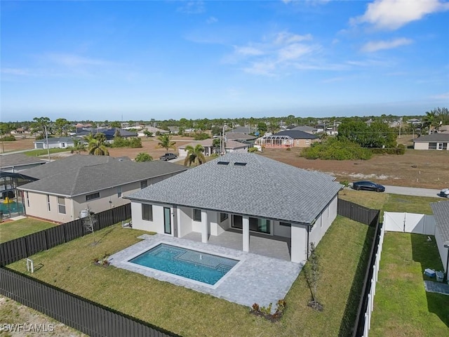 view of swimming pool with a patio area and a lawn