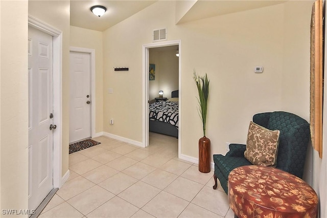 tiled foyer with lofted ceiling