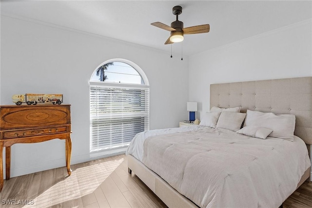 bedroom with hardwood / wood-style flooring and ceiling fan