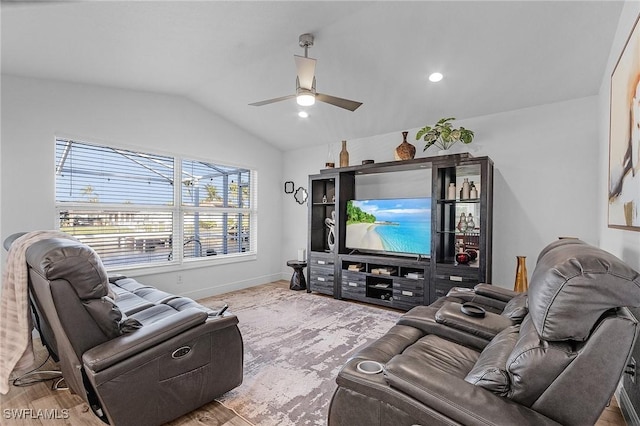 living room with hardwood / wood-style floors, ceiling fan, and lofted ceiling