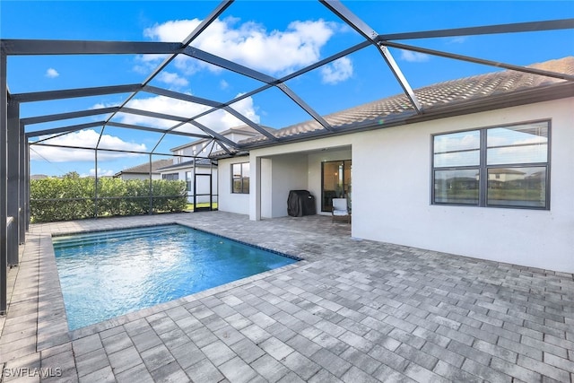 view of pool featuring a patio area and a lanai