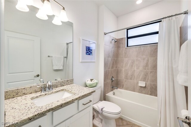 full bathroom with vanity, toilet, shower / bathtub combination with curtain, and tile patterned flooring