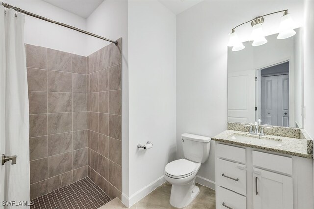 bathroom featuring vanity, toilet, and walk in shower