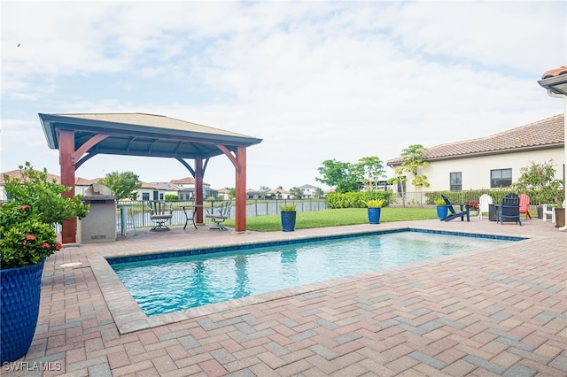 view of swimming pool with a gazebo, a patio, and a lawn