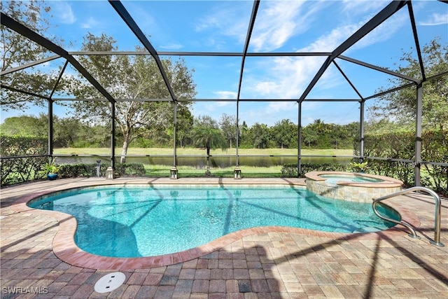 view of swimming pool featuring glass enclosure, an in ground hot tub, and a patio