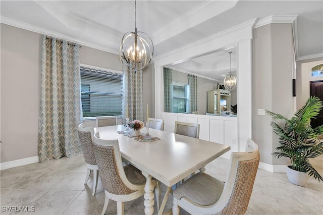 dining area with ornamental molding and a chandelier