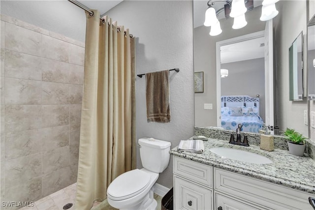 bathroom featuring a shower with curtain, vanity, and toilet