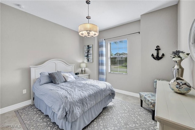 bedroom featuring an inviting chandelier