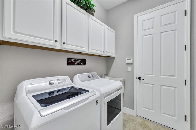 washroom with cabinets and independent washer and dryer