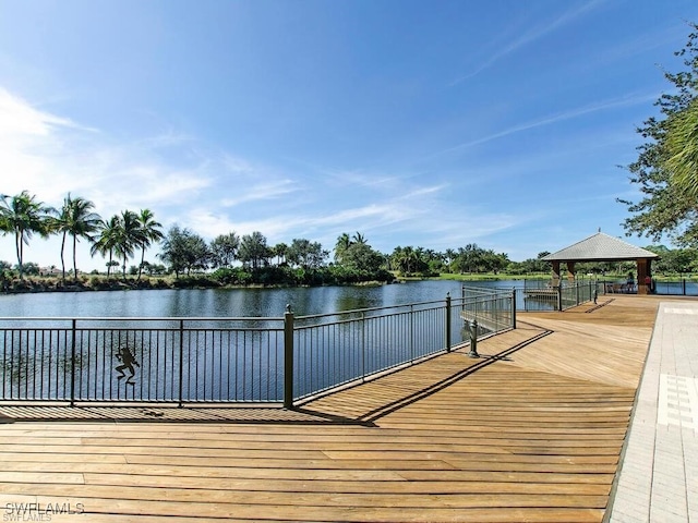 view of dock with a gazebo and a water view