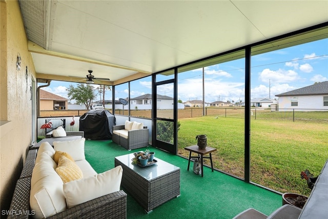 sunroom / solarium with ceiling fan