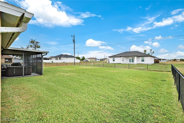 view of yard featuring a sunroom