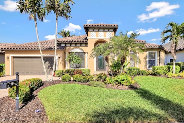 mediterranean / spanish house featuring a garage and a front lawn