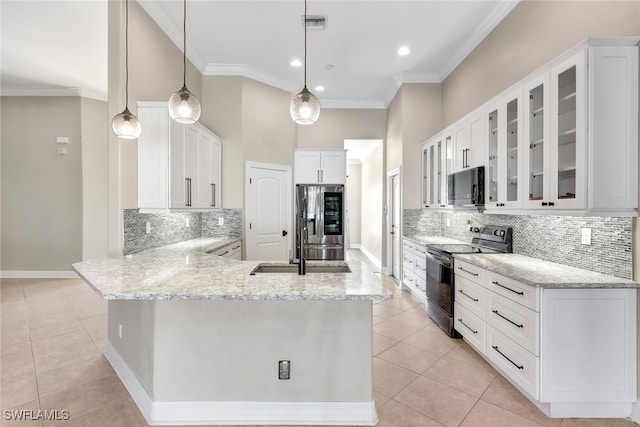 kitchen with stainless steel appliances, light tile patterned floors, kitchen peninsula, pendant lighting, and white cabinets