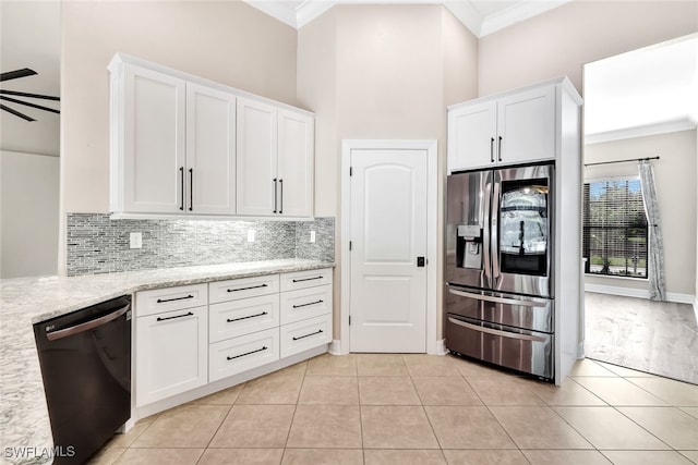 kitchen featuring stainless steel fridge, crown molding, white cabinetry, and black dishwasher