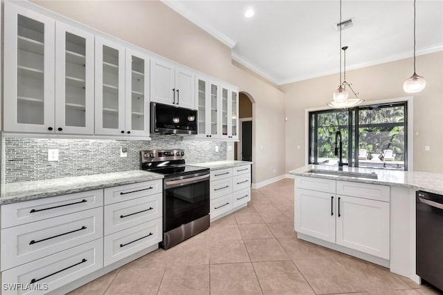 kitchen with tasteful backsplash, sink, white cabinets, and stainless steel appliances