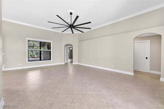 tiled empty room featuring ceiling fan and crown molding