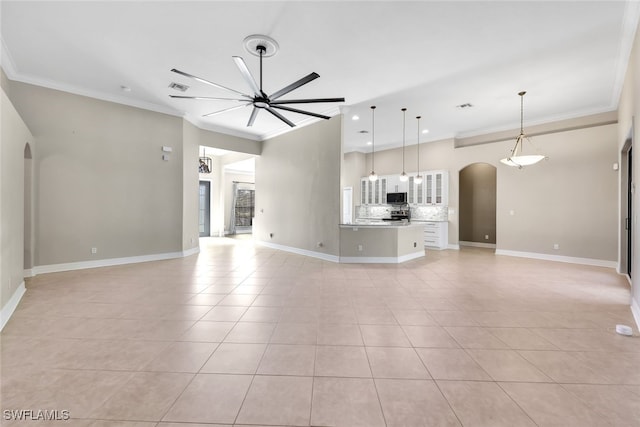 unfurnished living room with light tile patterned floors, ceiling fan, and crown molding