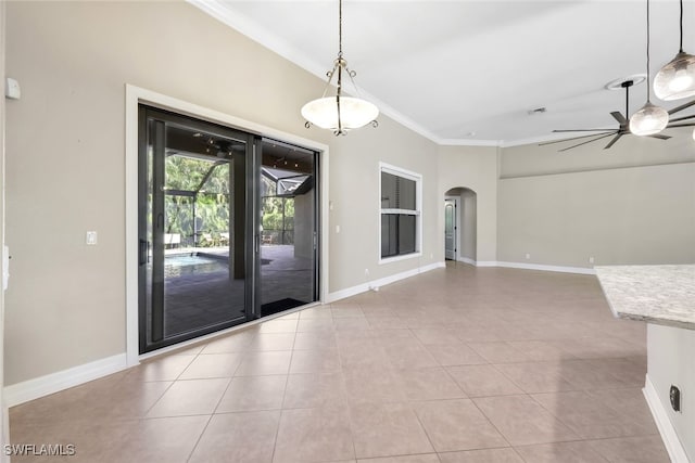 interior space featuring light tile patterned floors, ceiling fan, and crown molding