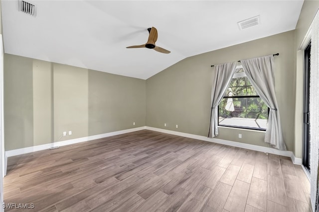 spare room featuring ceiling fan, light hardwood / wood-style floors, and lofted ceiling