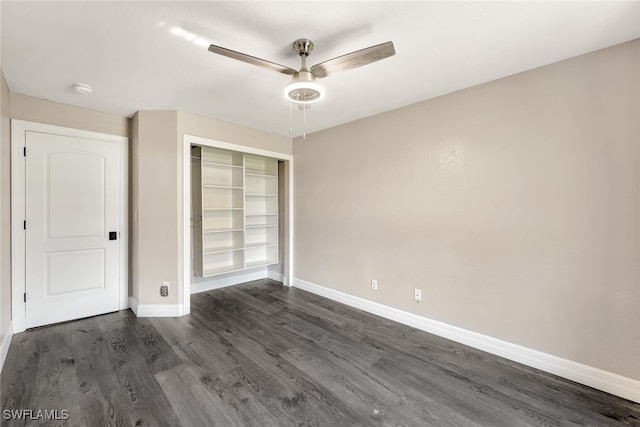 empty room featuring ceiling fan and dark wood-type flooring