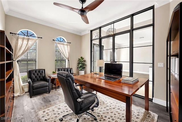 office with ceiling fan, wood-type flooring, and ornamental molding