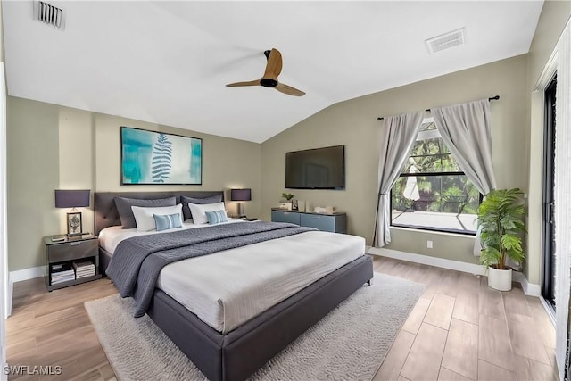 bedroom with light wood-type flooring, vaulted ceiling, and ceiling fan