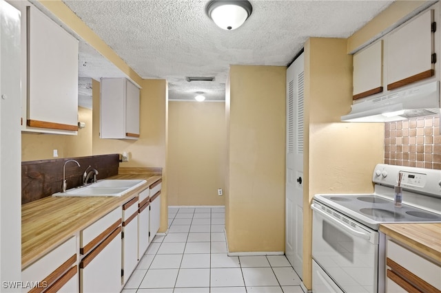 kitchen featuring sink, white cabinets, and white electric range