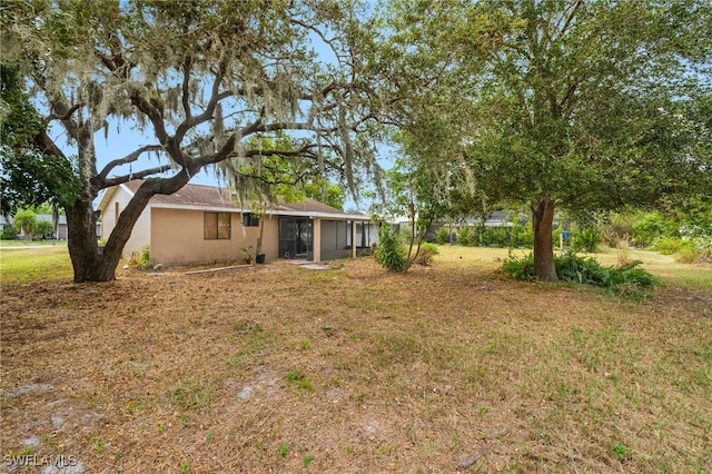 view of yard featuring a sunroom