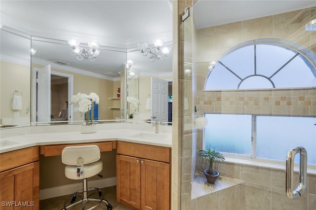 bathroom featuring vanity, a shower with shower door, a notable chandelier, and ornamental molding