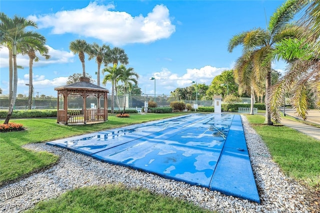 surrounding community featuring a gazebo and a lawn