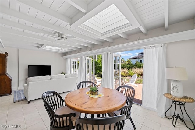 tiled dining room featuring beam ceiling and ceiling fan