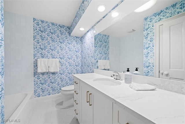 bathroom featuring tile patterned floors, vanity, and toilet