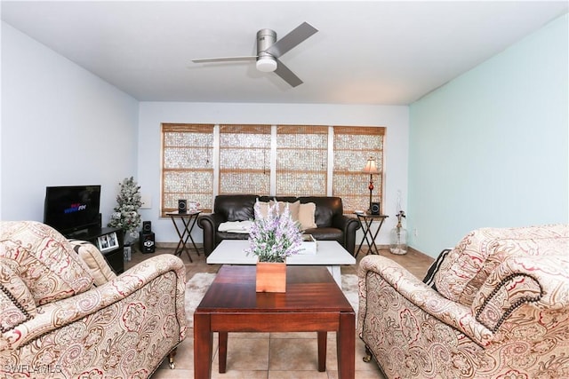 living room featuring ceiling fan and light tile patterned floors