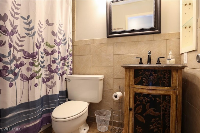 bathroom with tile walls and toilet