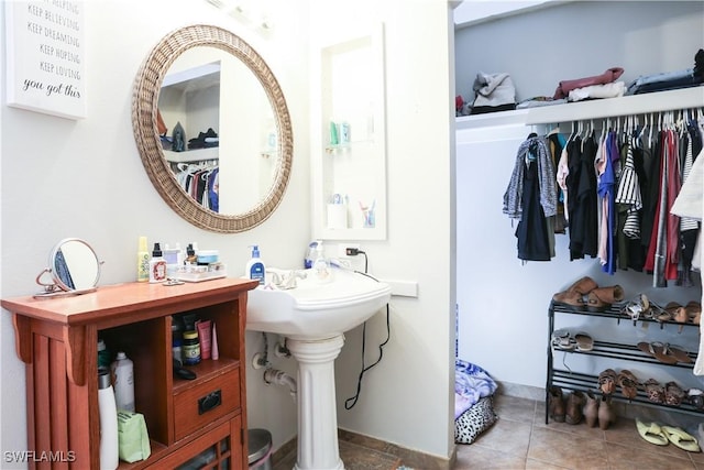 bathroom featuring tile patterned flooring and sink